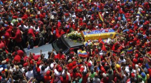 Thousands crowd the streets of Caracas as they mourn their president.